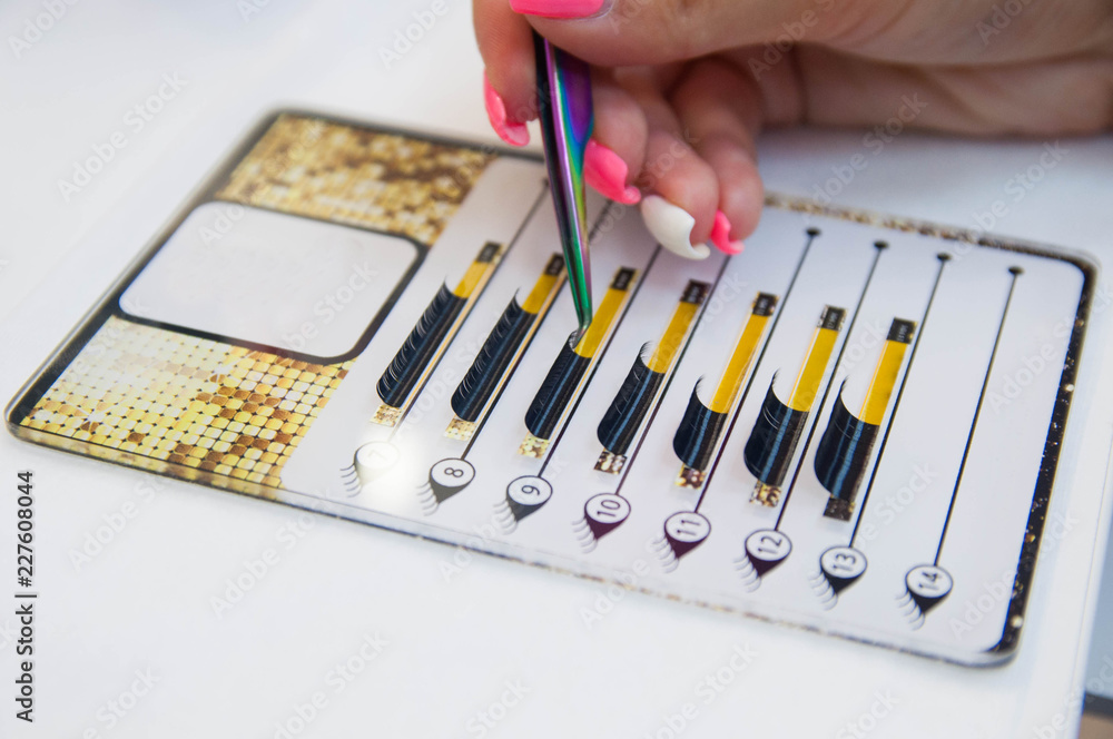 Instruments: Beauty and fashion concept - Eyelash Extension Procedure. Tools for eyelash extension. glue, tweezers Instruments: Beauty and fashion concept - Eyelash Extension Procedure. Tools for eyelash extension. glue, tweezers