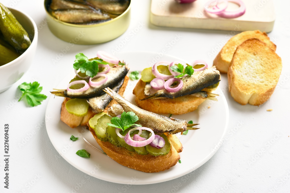 Sandwiches with sprats, marinated cucumber and onion Sandwiches with sprats, marinated cucumber and onion