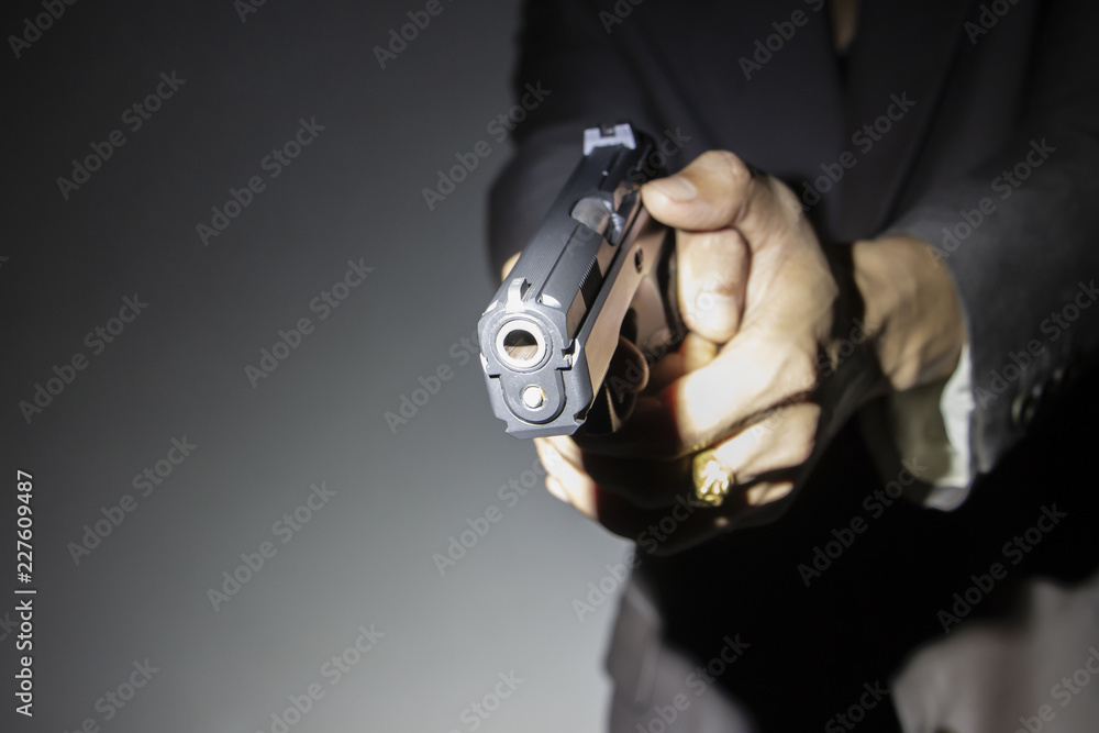 close up gunman on dark background