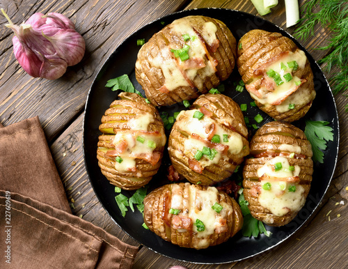 Baked potatoes with bacon, green onion and cheese
