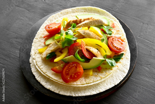 Taco with chicken meat and vegetables