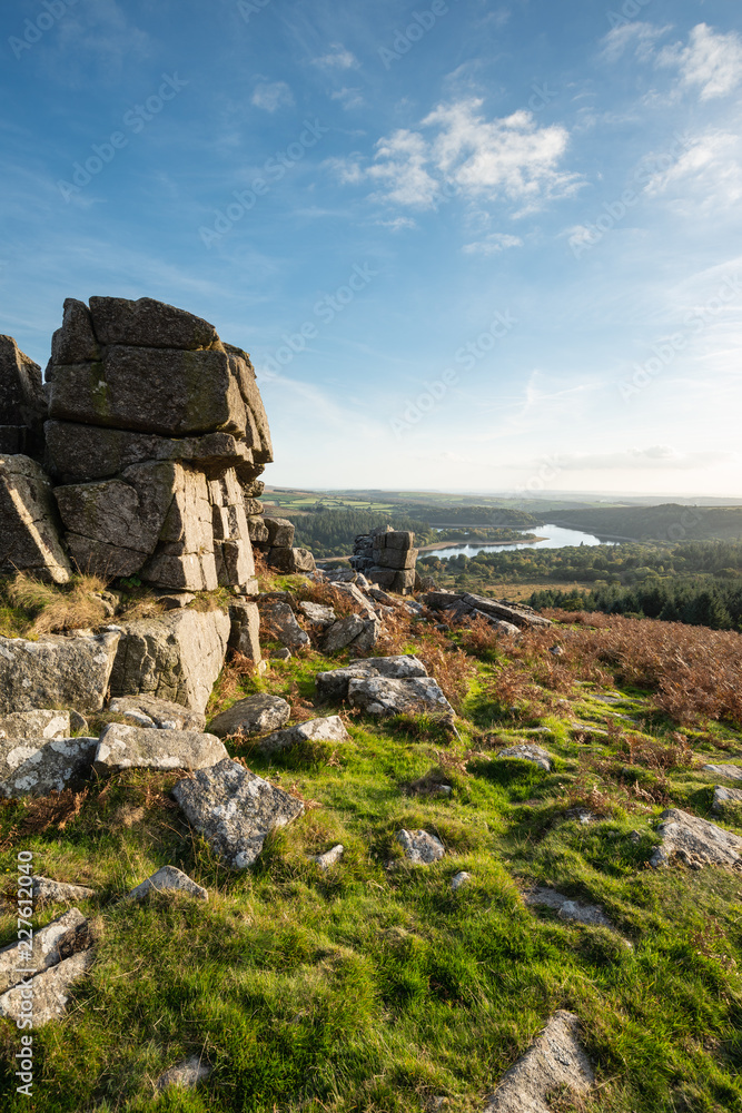 Stunning Autumn sunset landscape image of view from Leather Tor towards Burrator Reservoir in Dartmoor National Park