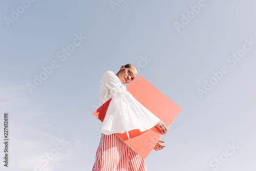 girl with red board photo