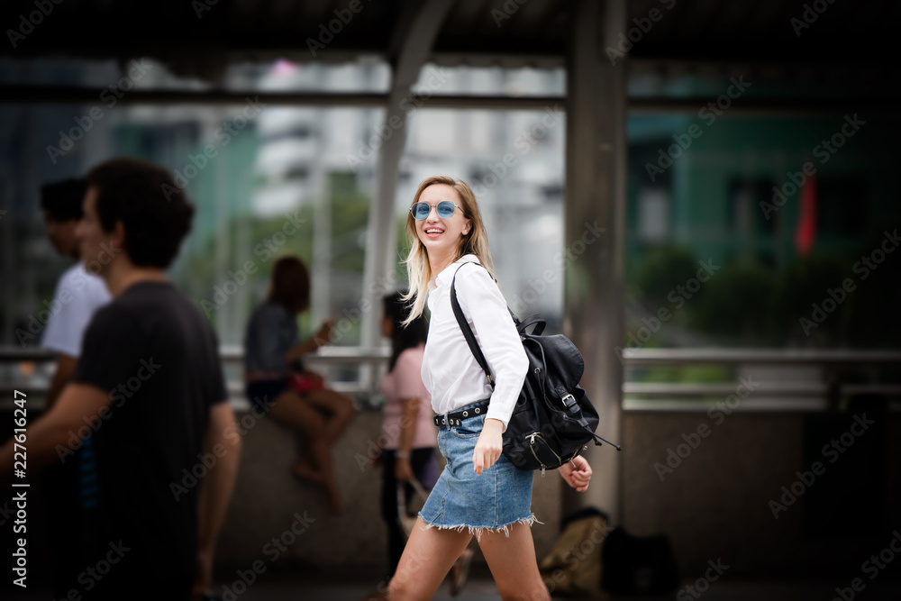 young woman walking on the street in paris