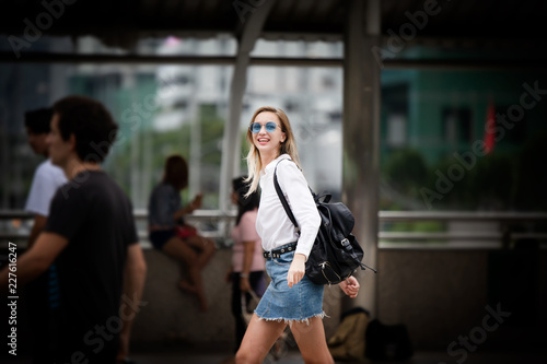 young woman walking on the street in paris