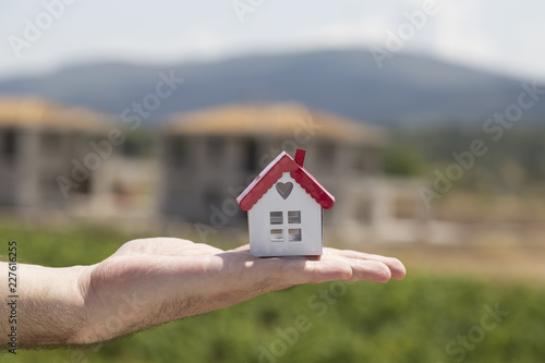 Real estate and mortgage investment. House on the hand.