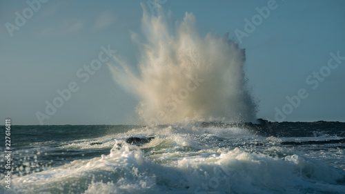 Waves crashing on rocks.