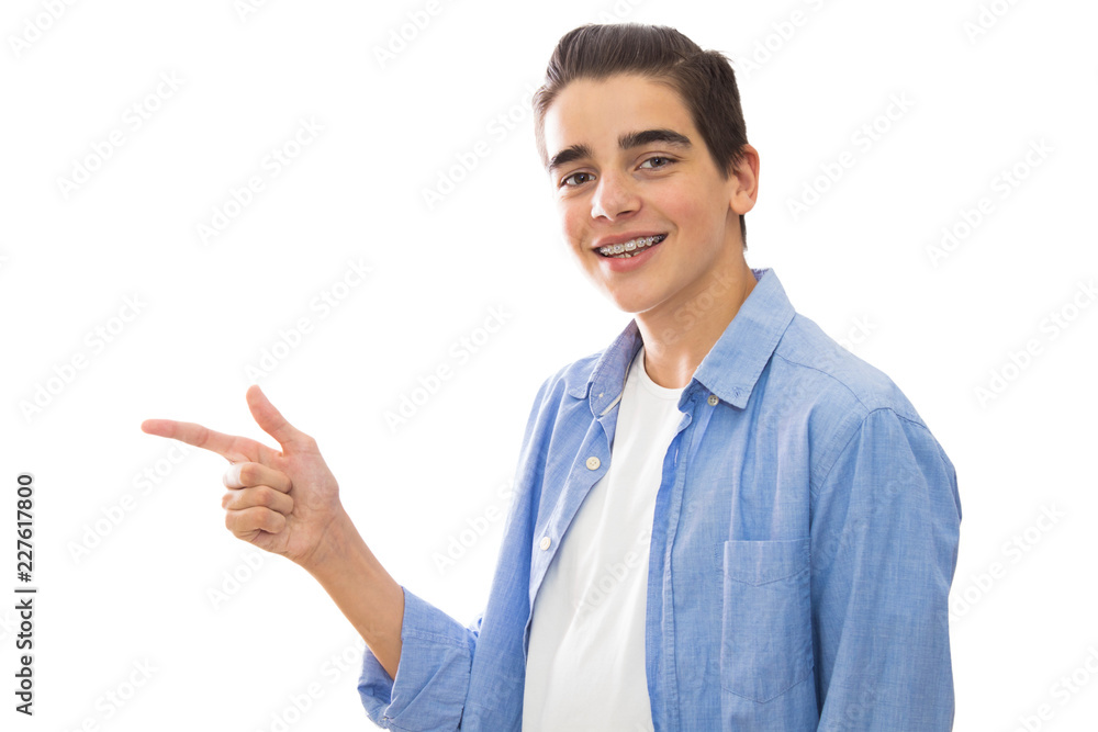 portrait of young with braces isolated in white pointing portrait of young with braces isolated in white pointing