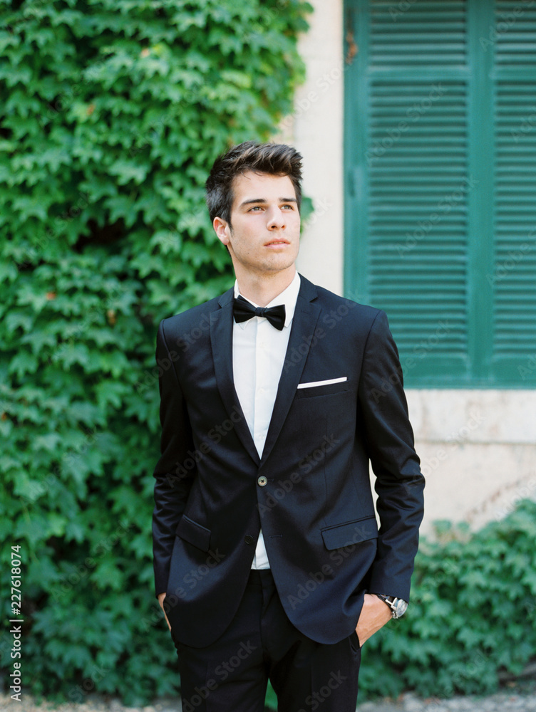 Cheerful man in suit on step Cheerful man in suit on step