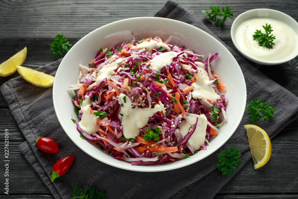 Coleslaw salad with red, white cabbage, carrot, parsley, sesame seeds. served with mayonnaise and lemon Coleslaw salad with red, white cabbage, carrot, parsley, sesame seeds. served with mayonnaise and lemon