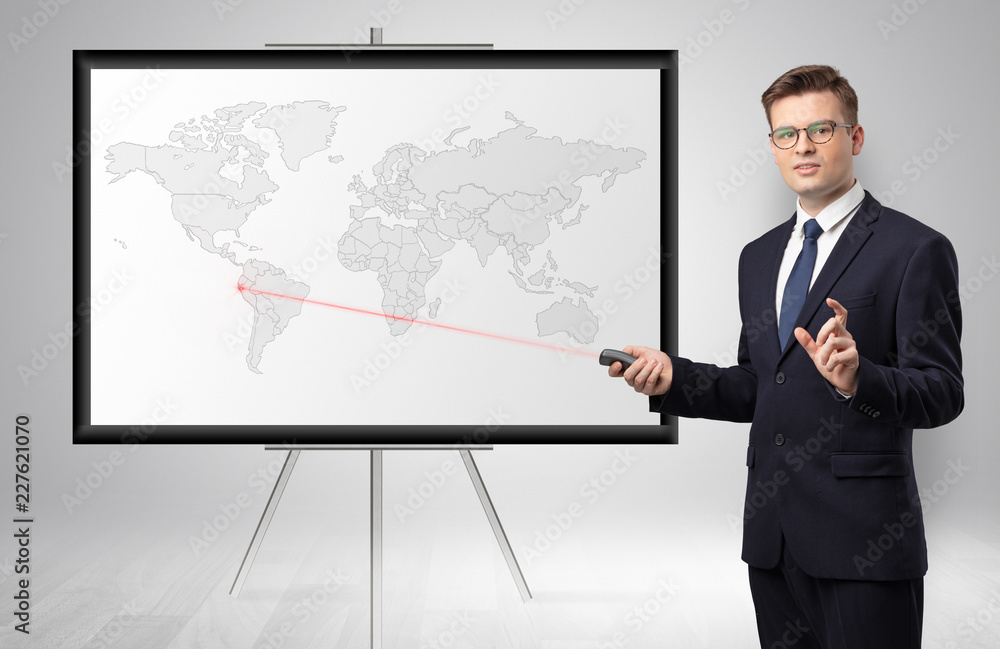 Handsome businessman with laser pointer presenting potential business area on map
Handsome businessman with laser pointer presenting potential business area on map