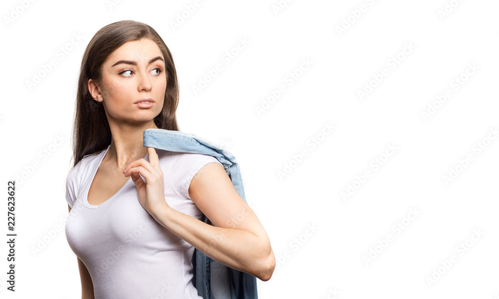 custom made wallpaper toronto digitalClose up portrait of young beautiful brunette woman in white t-shirt, holding jeans shirt and looking other her shoulder isolated against white background, copy space