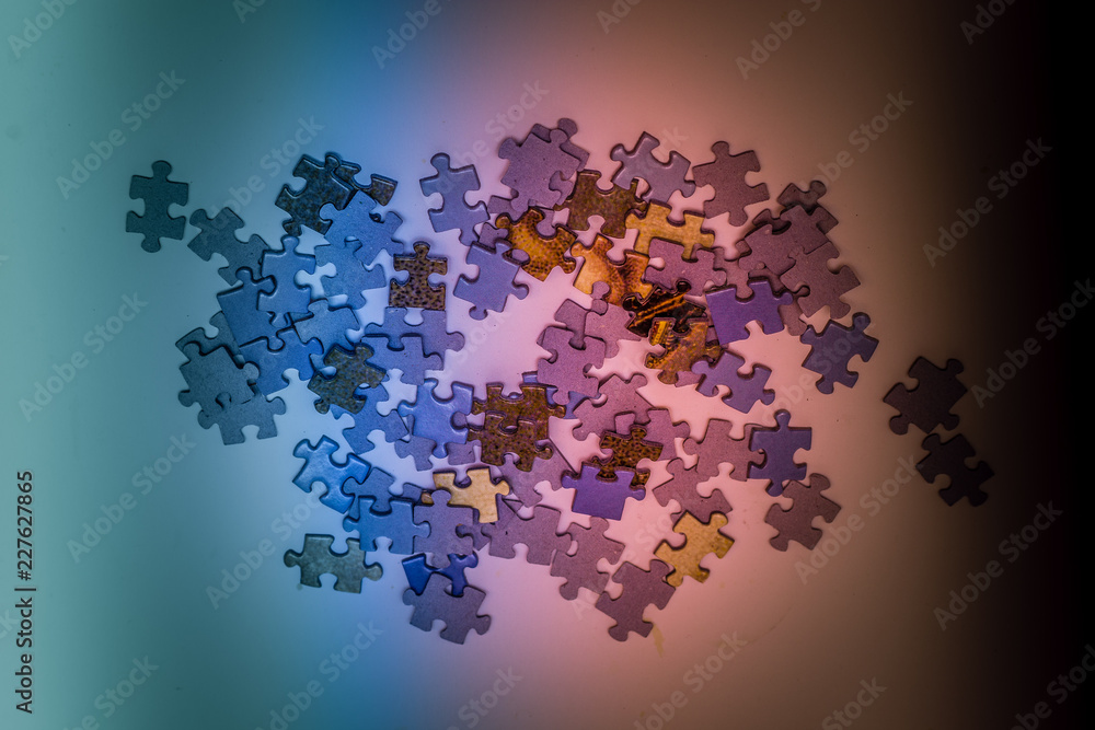 Fototapeta premium Selective focus of pieces puzzle jigsaw, puzzle background. Jigsaw puzzle color background.
