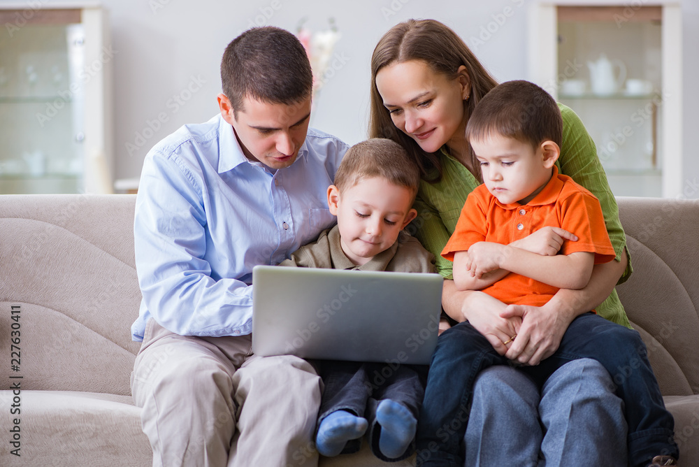 Young family surfing internet and looking at photos Young family surfing internet and looking at photos
