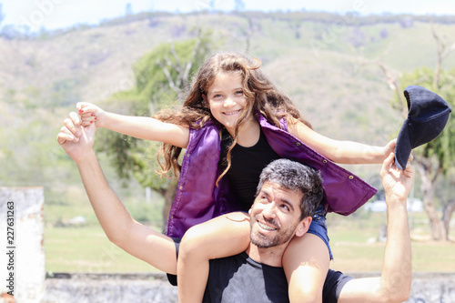 Father and daughter having fun outdoors © CESARVR