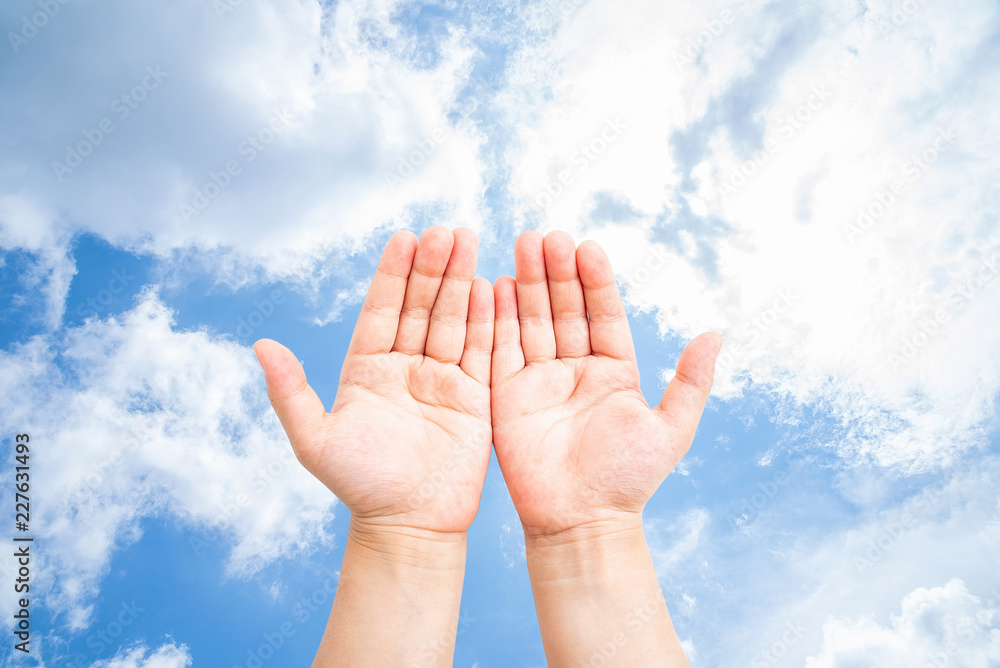 Children's hands holding gestures in the sky