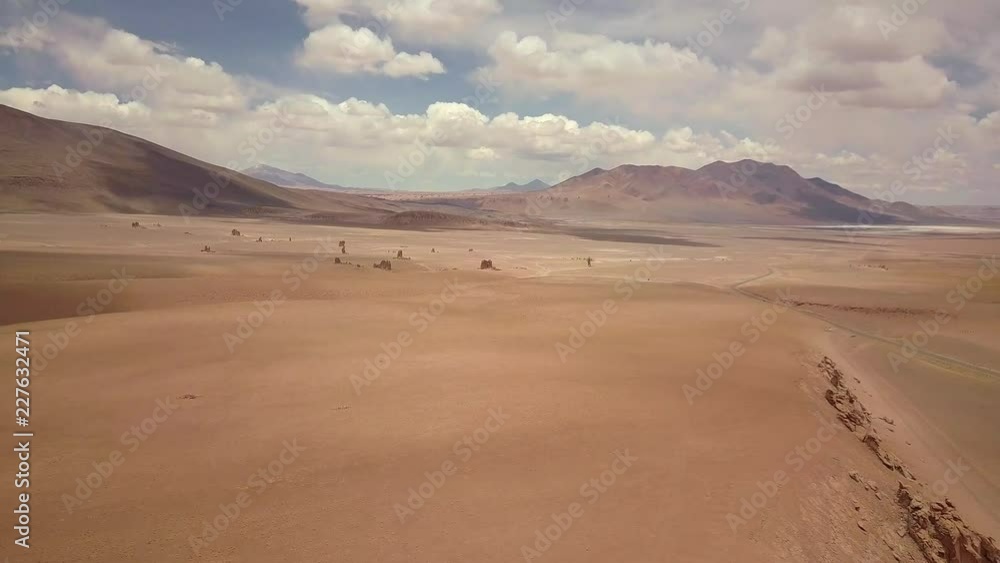 Vast emptiness in the Atacama desert aerial view across flat high altitude plateau aerial flying up Vast emptiness in the Atacama desert aerial view across flat high altitude plateau aerial flying up
