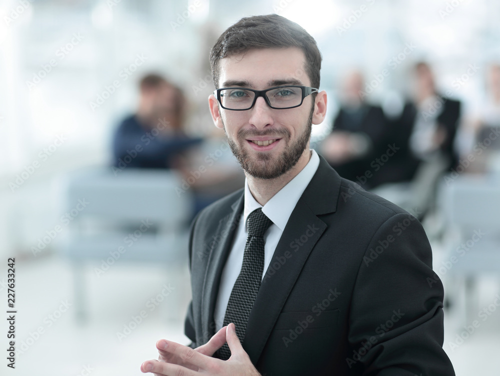 successful businessman on blurred background business team. successful businessman on blurred background business team.