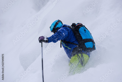 freeride skier skiing downhill photo