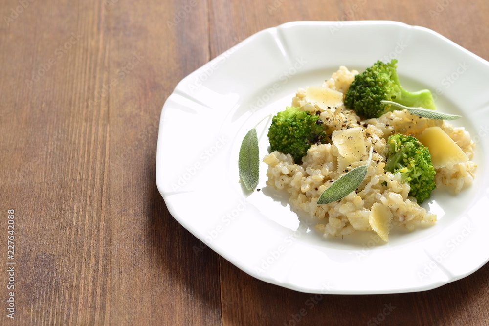 Brown rice with broccoli and parmesan cheese, copy space Brown rice with broccoli and parmesan cheese, copy space