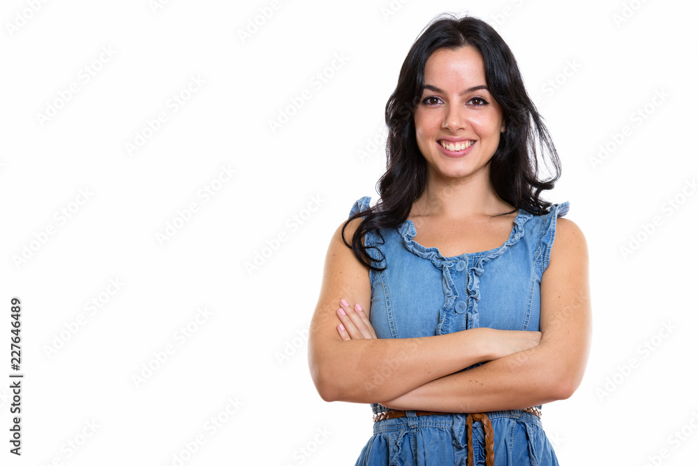 Studio shot of young happy beautiful Spanish woman smiling with Studio shot of young happy beautiful Spanish woman smiling with