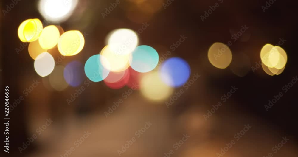 Blurred video backdrop of pretty out of focus lights in urban setting Blurred video backdrop of pretty out of focus lights in urban setting
