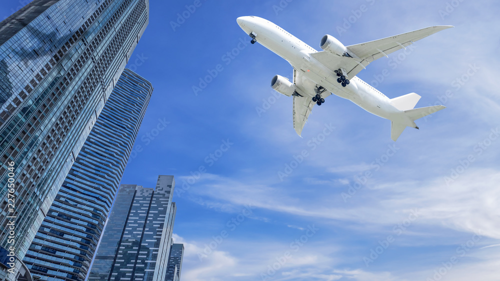Airplane flying over modern building 3