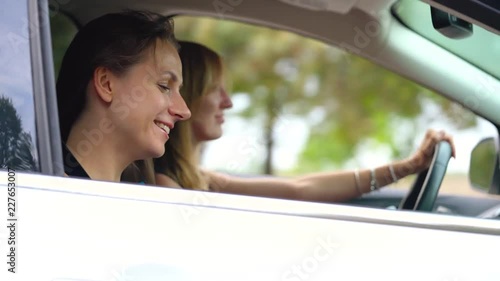 Wallpaper Mural Two young women ride in a car and have fun Torontodigital.ca