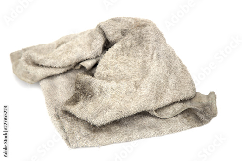 Cloth rag with stains on white background. photo