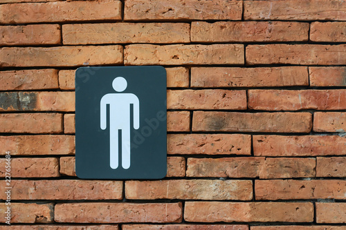 Public Men's Toilet Symbol on a brick wall