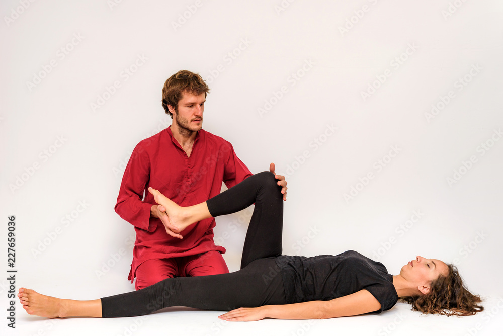 Photo of yoga poses for two stretching and relaxing on a white background. Photo of yoga poses for two stretching and relaxing on a white background.