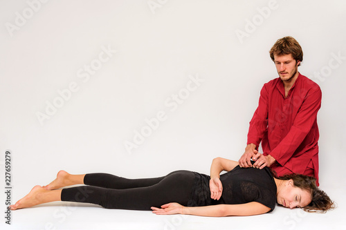 Photo of yoga poses for two stretching and relaxing on a white background.