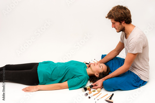 Photo on white background facial massage.