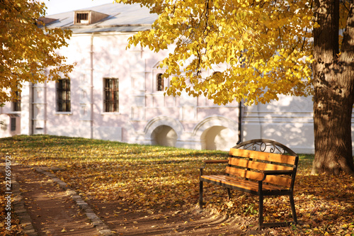 Lonely wooden bench in the autumn Park © zinovskaya