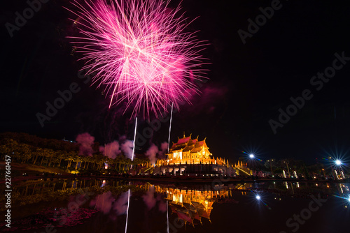 Fireworks celebrate the New Year 2018 at Rajapruek Royal Park, Chiang Mai with beutiful light of Hor Khum Luang temple,Thai Tradition Building