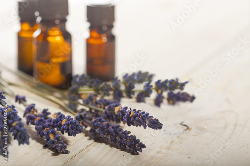 Fototapeta Naklejka Na Ścianę i Meble -  Branch of a lavender and bottles