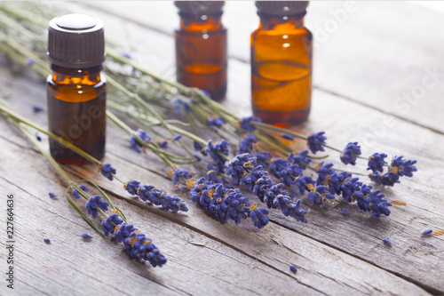 Fototapeta Naklejka Na Ścianę i Meble -  Branch of a lavender and bottles