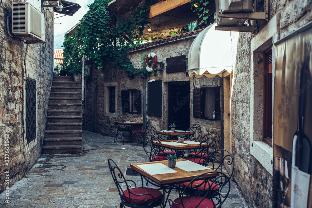 Naklejka premium Restaurant in calm street of the Old town, Budva, Montenegro