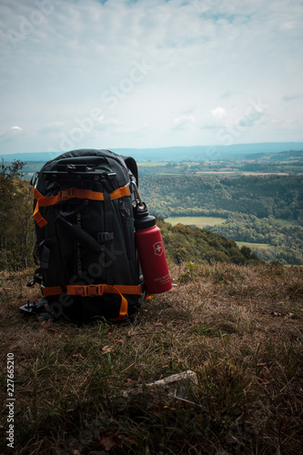 water bottle and backpack in adventure photo