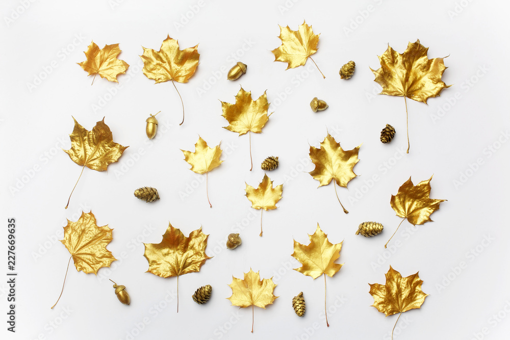 Fototapeta premium Autumn composition. Pattern made of autumn golden leaves on light background. Flat lay, top view