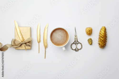 Christmas composition. christmas golden decorations on light background. Top view, flat lay