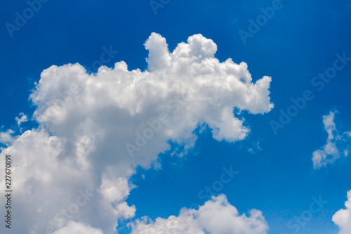 Animal cloud on blue sky, White soft cloudy with shaping like Rhino monster in sunny day, image for business target / imagination kids learning / meteorology presentation / inspiration concept photo