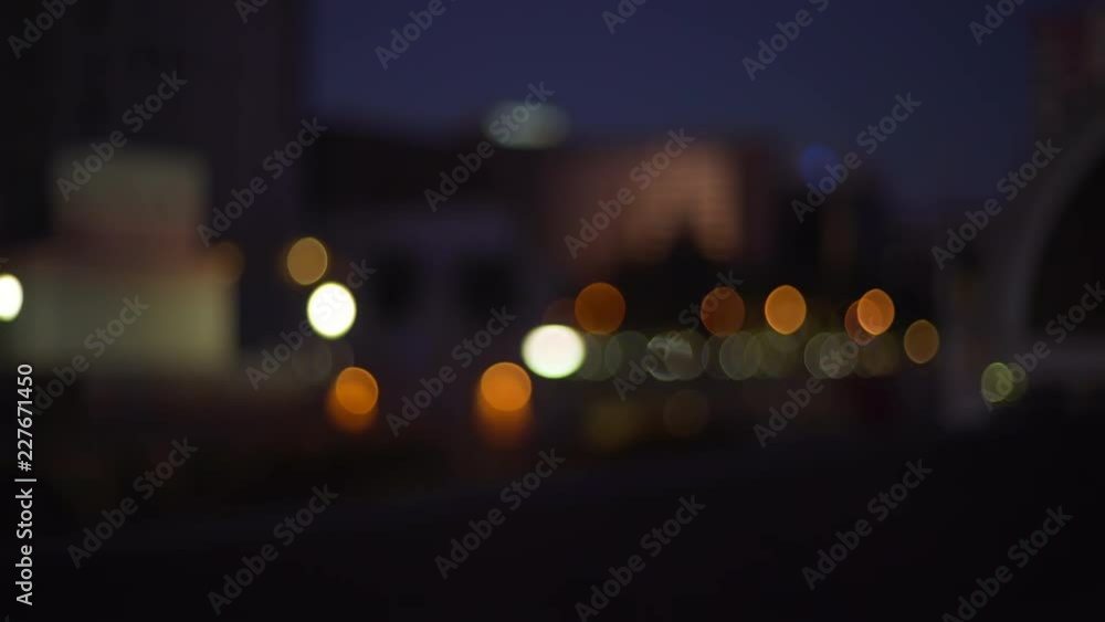 Out of focus background plate of city skyline and bokeh lights Out of focus background plate of city skyline and bokeh lights