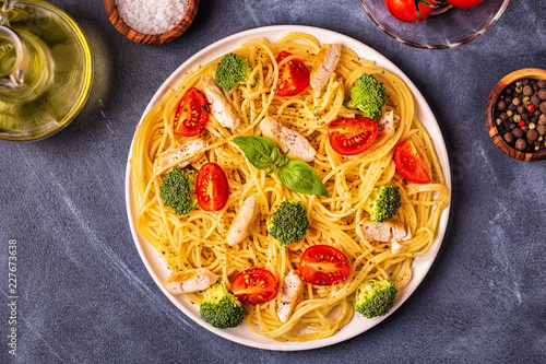 Plate of spaghetti tomato broccoli chicken