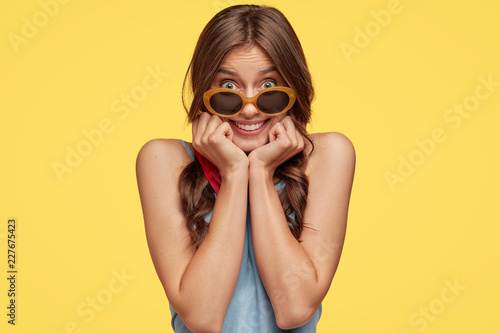 Portrait of satisfied pleased girlfriend spends vacation with boyfriend, wear...
