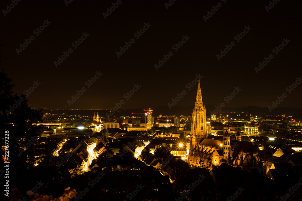 Germany, Night lights over Freiburg im Breisgau and the minster