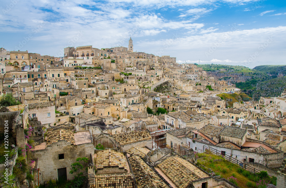 Matera panoramic view of historical centre Sasso Caveoso of old ancient town Sassi di Matera with rock cave houses, European Capital of Culture, UNESCO World Heritage Site, Basilicata, Southern Italy