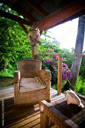 armchairs on a terrace in the jungle in the Carribean, Guadeloupe © Melinda Nagy