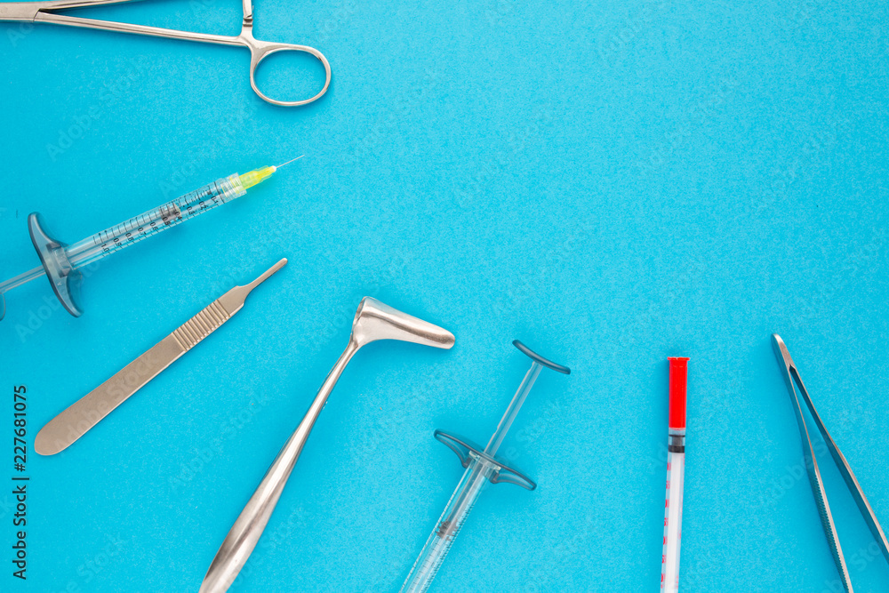 Flat lay of medical instruments on blue background. Mock up health care medical background. Flat lay of medical instruments on blue background. Mock up health care medical background.