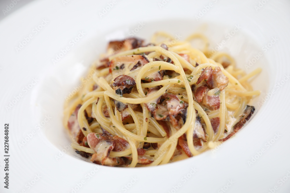 Spaghetti carbonara , Spaghetti white sauce with cheese bacon in outdoor restaurant italian food Spaghetti carbonara , Spaghetti white sauce with cheese bacon in outdoor restaurant italian food